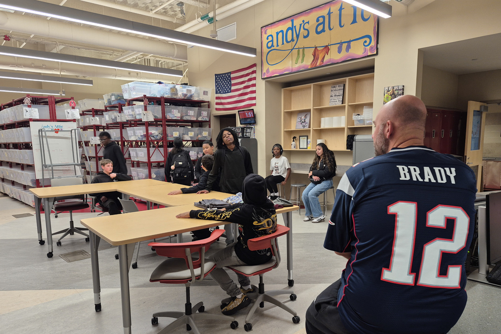 Students and staff at Andy's Attic for a clothing donation.