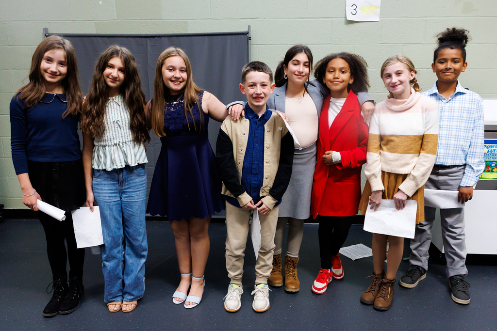The candidates of the sixth grade election stand side by side for a photo.