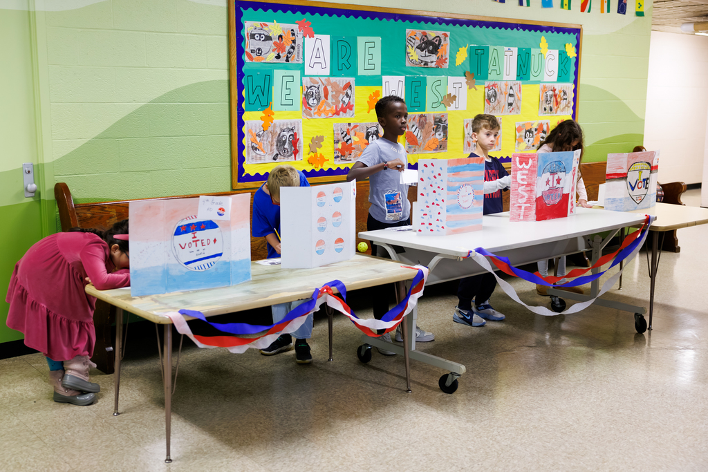 Students vote at the polls during a sixth grade election.