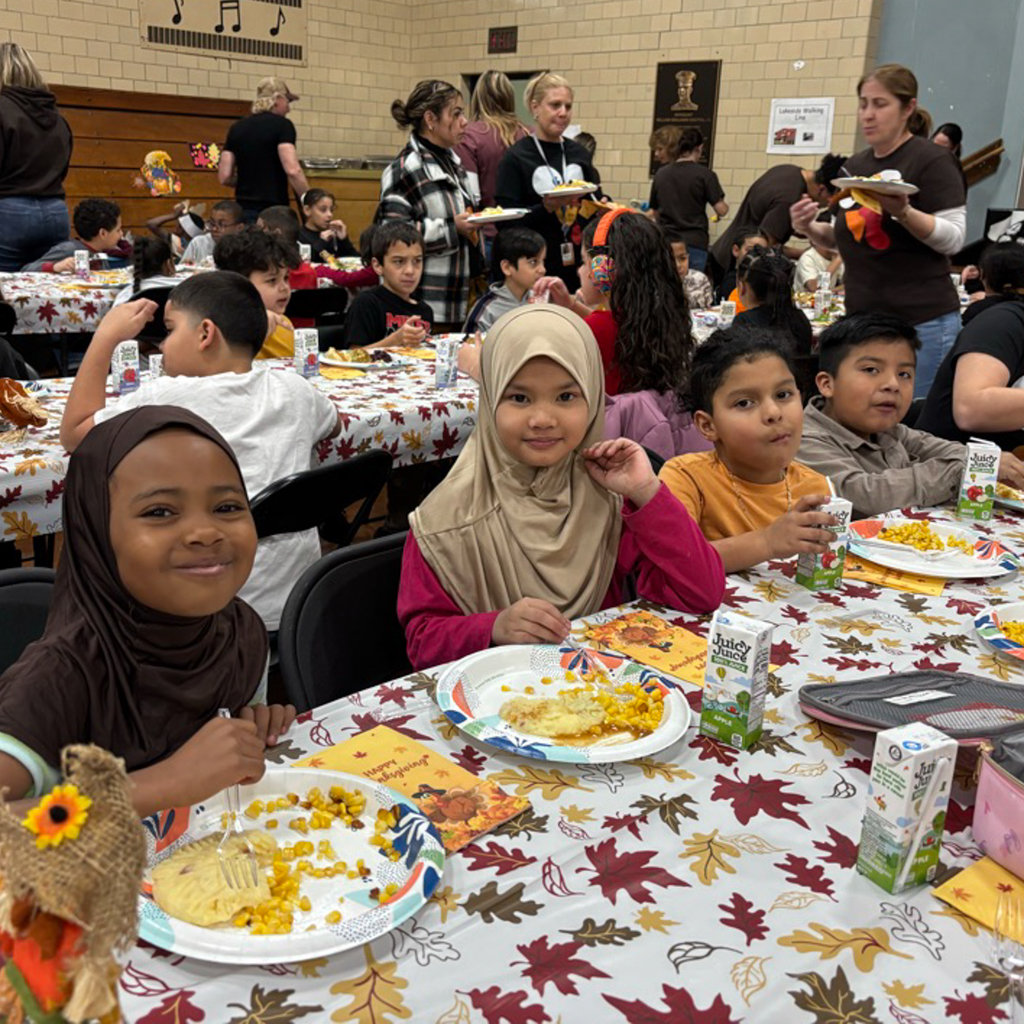 Students enjoy a Thanksgiving meal.