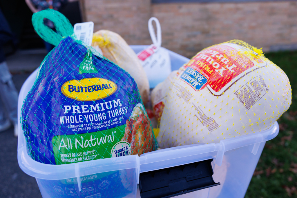 A bin of frozen turkeys at a donation event.