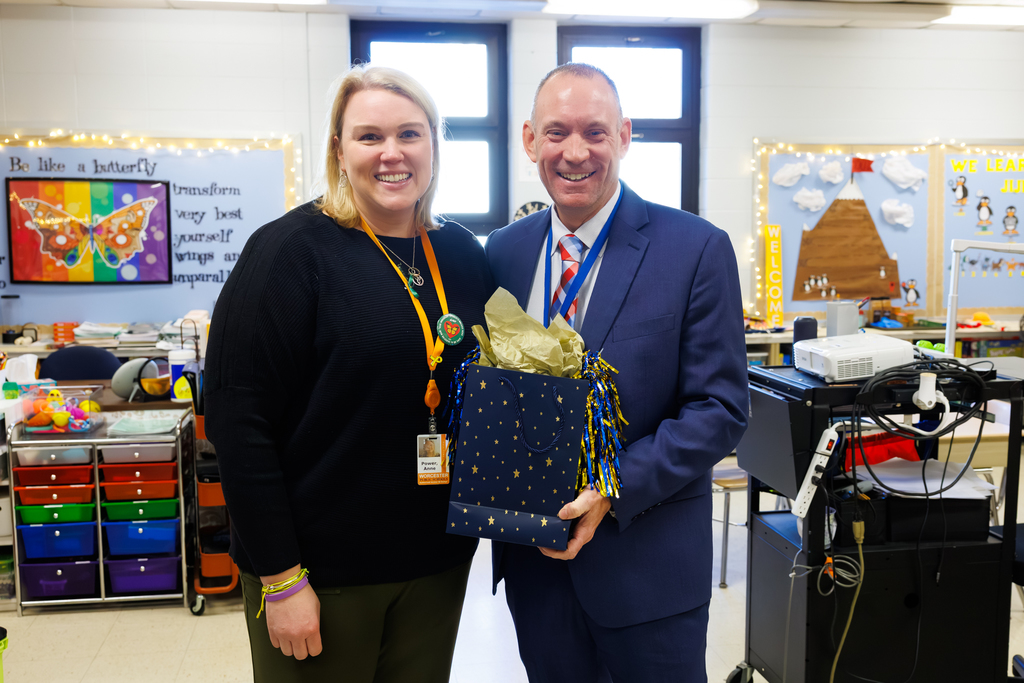 Superintendent Brian E. Allen with Canterbury Street TLS teacher Anne Power.