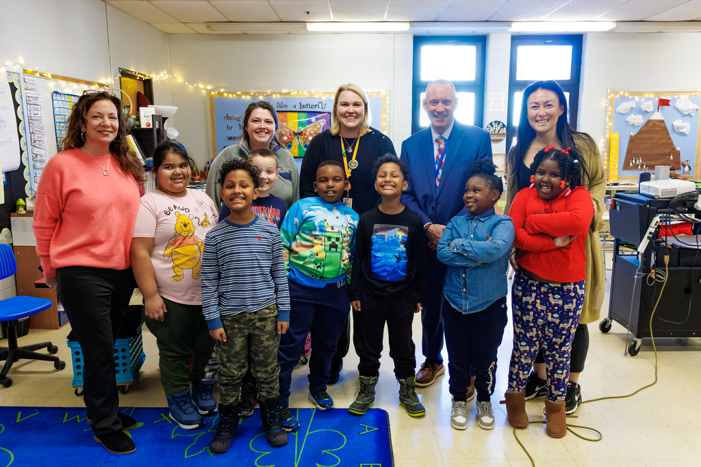 Canterbury Street's Anne Power alongside students and teachers of the school, and Superintendent Brian Allen.