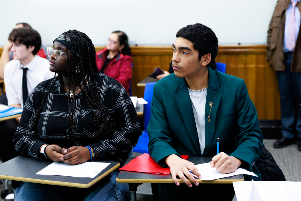 High school students engaged during a debate. 