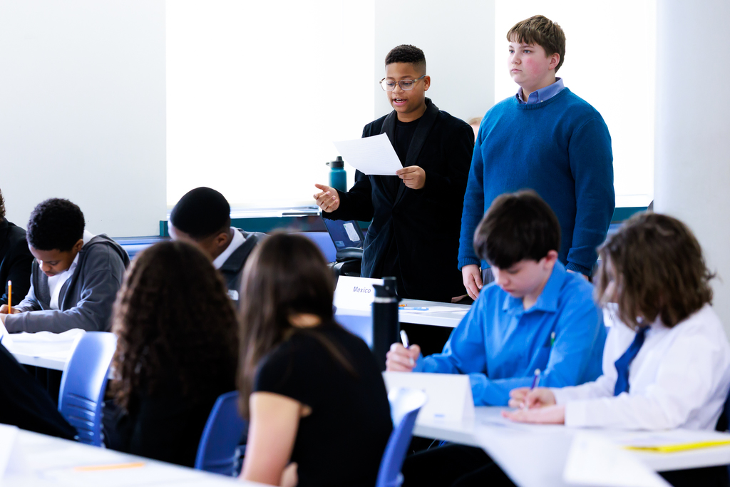 Students give a speech during a Model UN simulation.