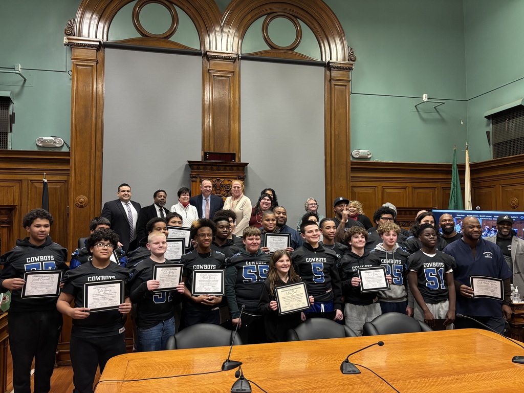 Worcester Cowboys football team holding certificates
