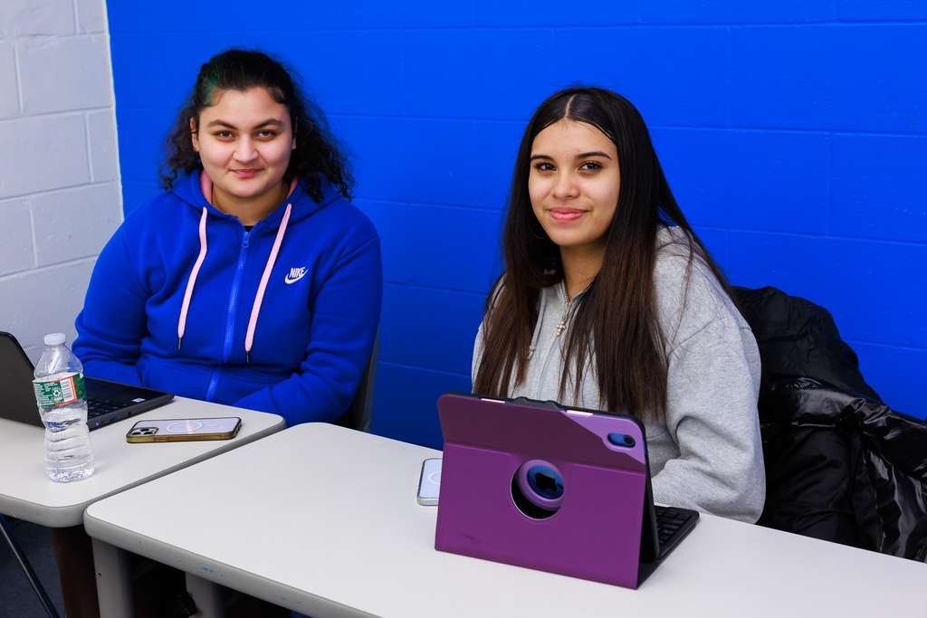 Two students smile for a photo during the first class of the WPS Grow Your Own Program.