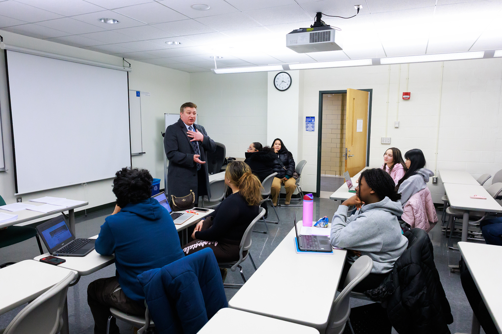 An adult talks to the class during the first day of the WPS Grow Your Own Program.
