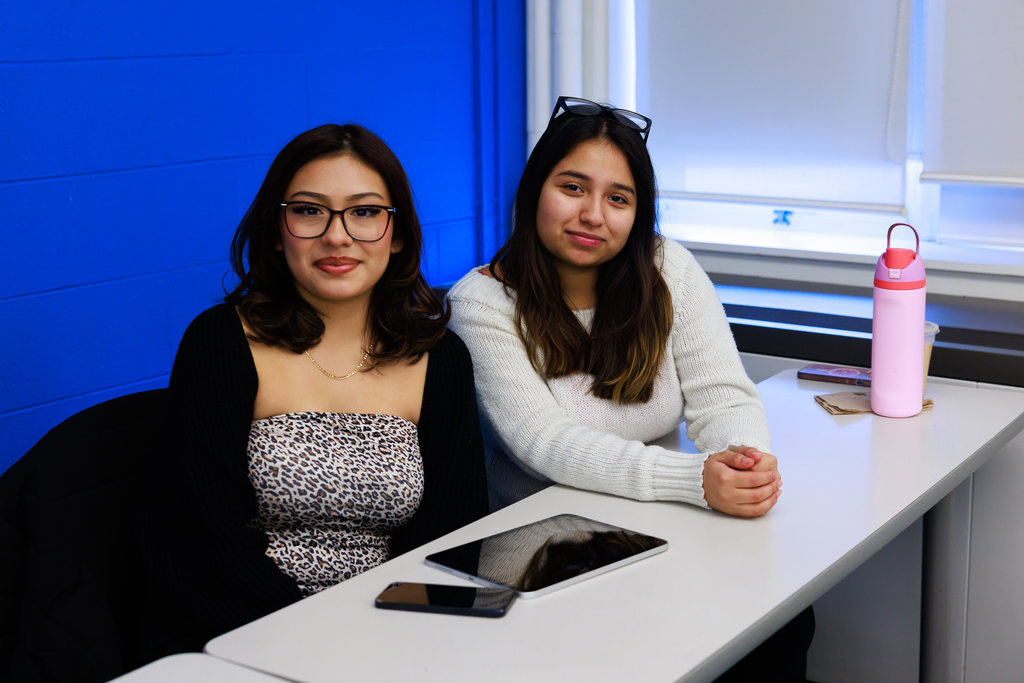 Two students smile for a photo during the first class of the WPS Grow Your Own Program.