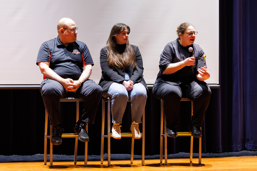 Three Worcester Tech alumni lead a Q/A session with students.
