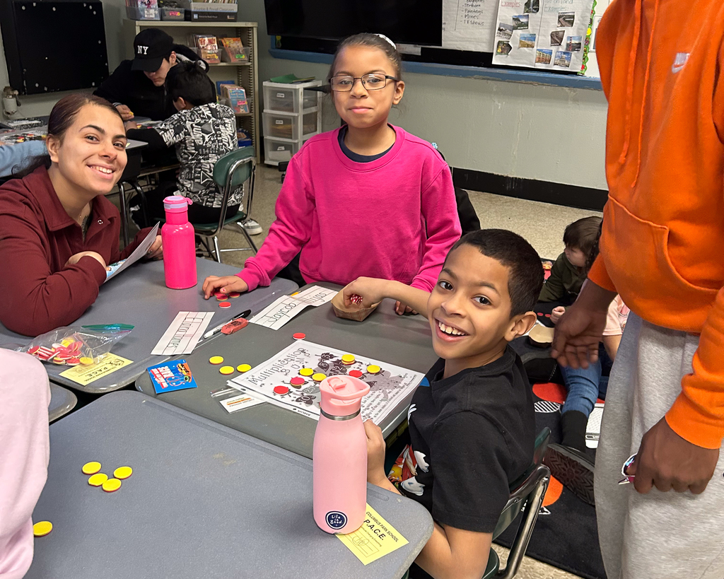 Students and families work together on math problems.