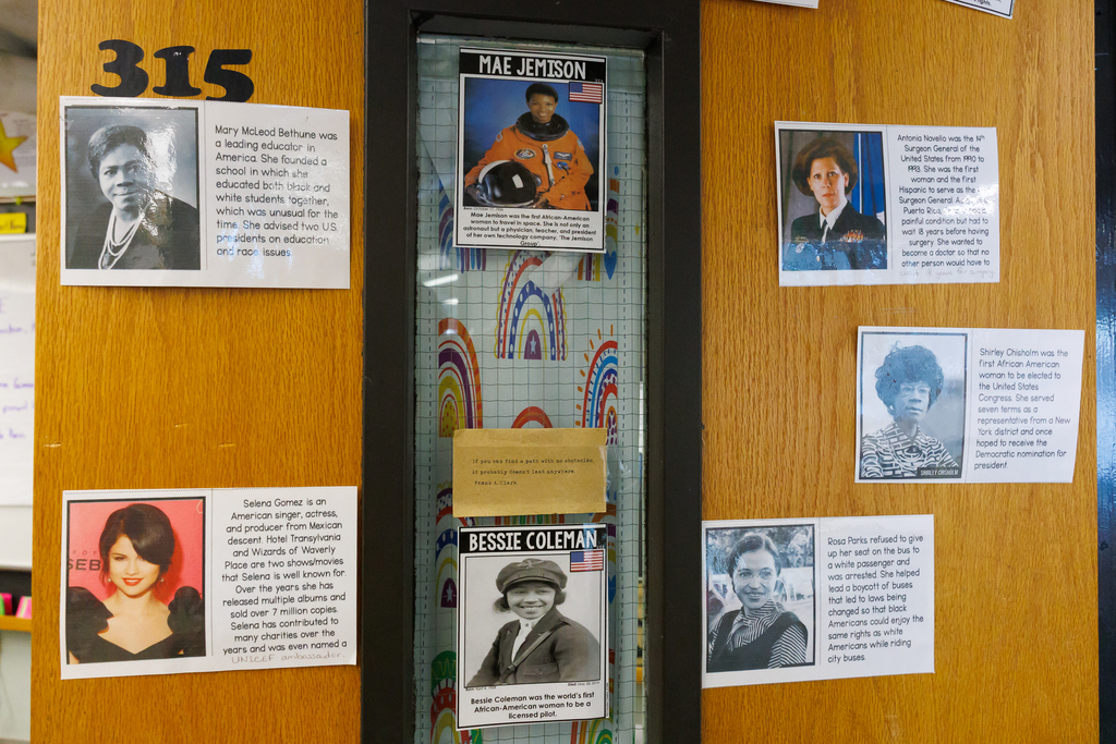 A door is adorned with images of influential women in history.