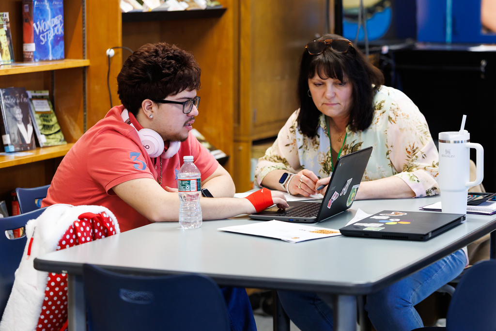 A student and representative of MassEdCo review their financial aid package.