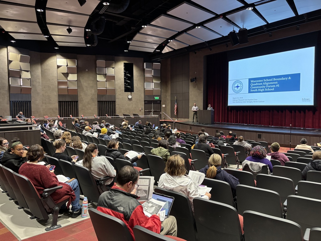 Audience members in an auditorium
