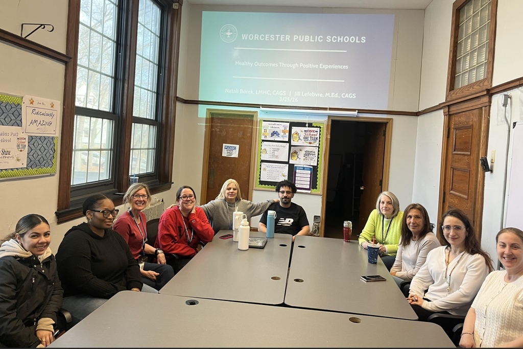 Ten paraeducators from Columbus Park sit around a table. 