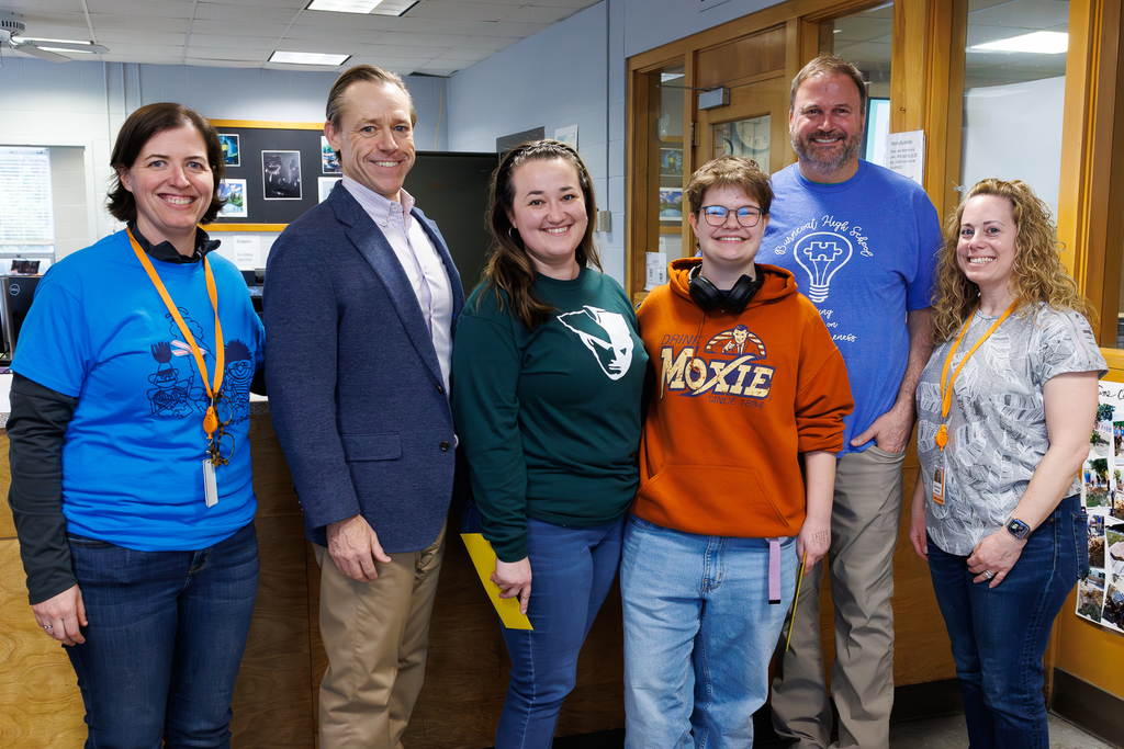 From left, Burncoat High School Assistant Principal Michaela Moylan-Faucher, Worcester Educational Development Foundation President Matt Wally, AP English teacher Lauren Delgado, senior Teddy Pearson, Principal Joe Ewick, and English Department Head Dawn Ashford stand for a photo following a surprise award announcement on April 2, 2026.