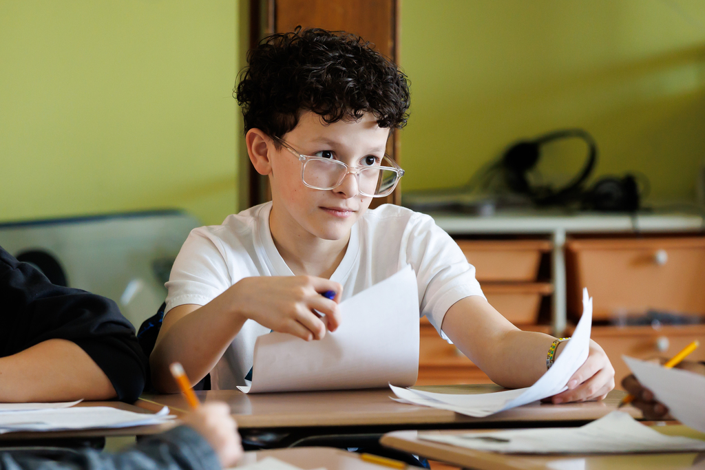 A student listens attentively during an after-school club.