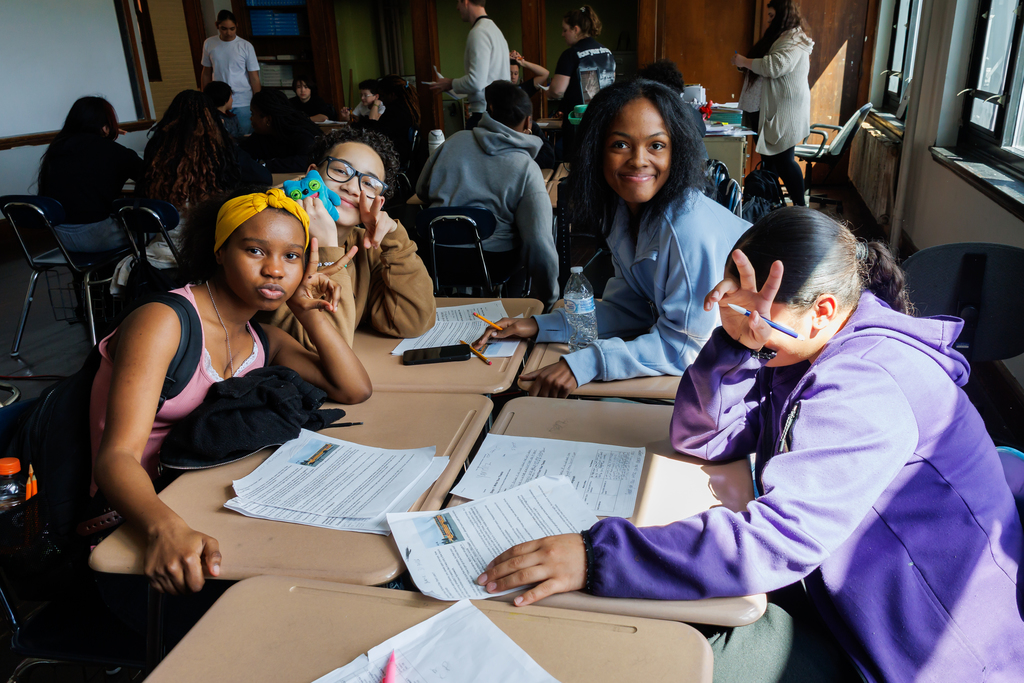 Four students pose together for a photo.
