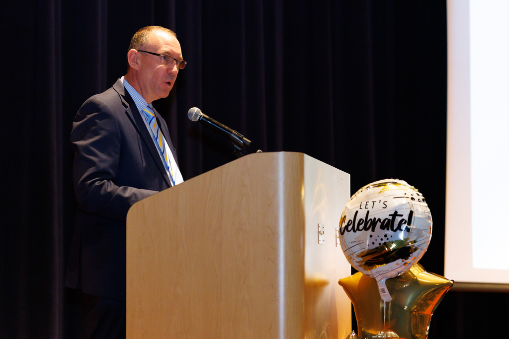 Superintendent Brian E. Allen speaks on the podium during the WPS Celebration of Success.