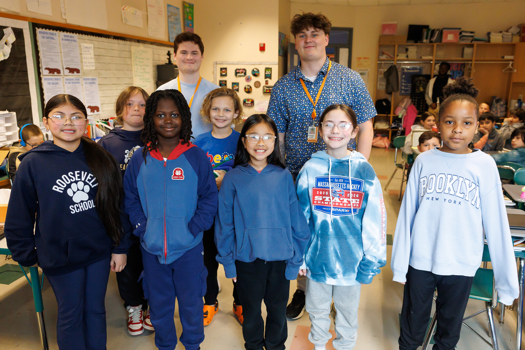 Teachers and students stand together wearing blue to close out Autism Awareness Month.