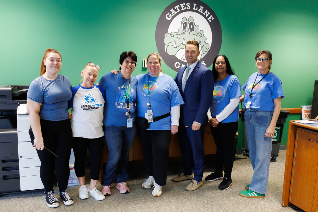 Front office staff from Gates Lane School stand together wearing blue to close out Autism Awareness Month.