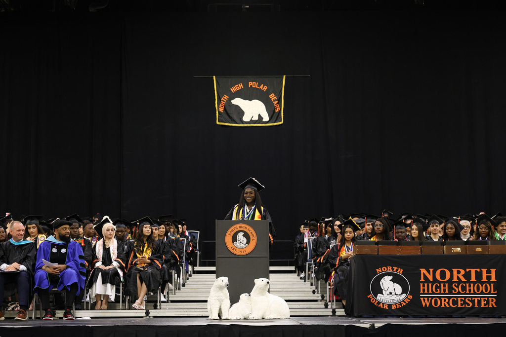 A student speaks at the podium during their high school graduation.