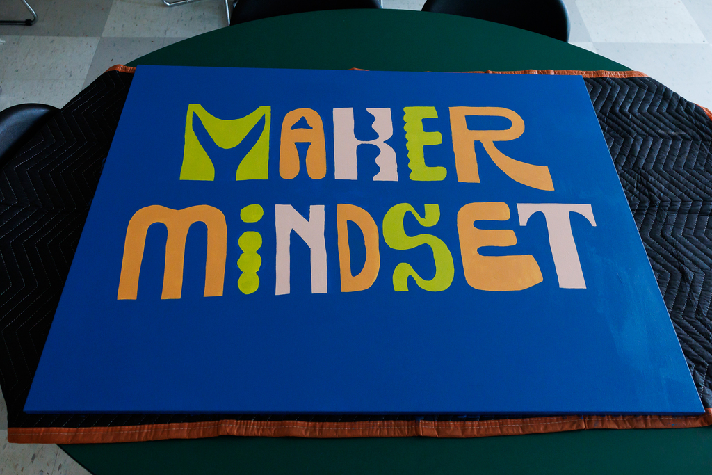 Volunteers painted new murals to hang on the walls to beautify common areas. 