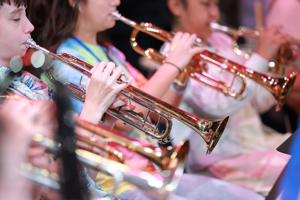 A row of trumpets is visible.