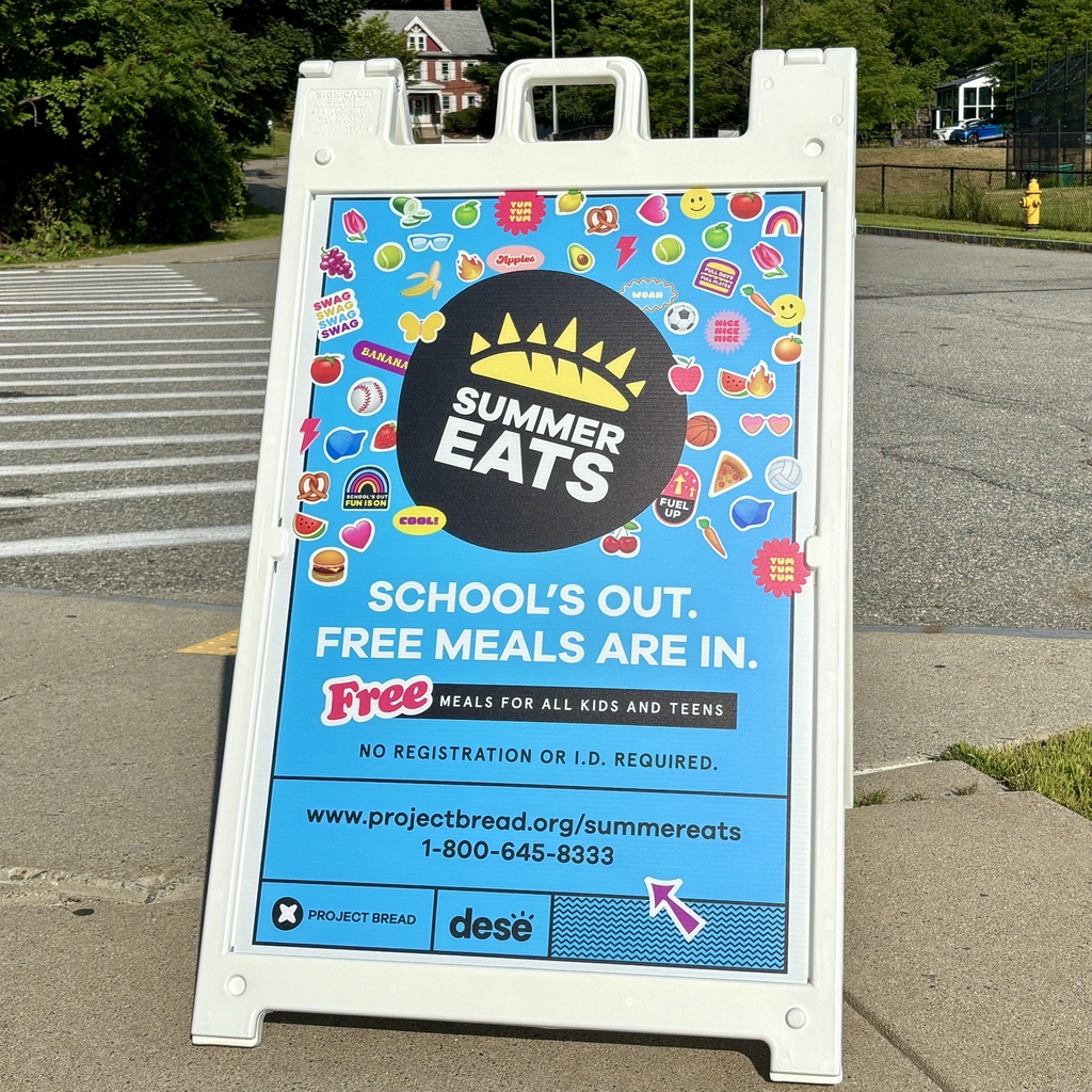 A white A-frame sign announces "Summer Eats: School's Out. Free Meals Are In." with colorful food and fun graphics.