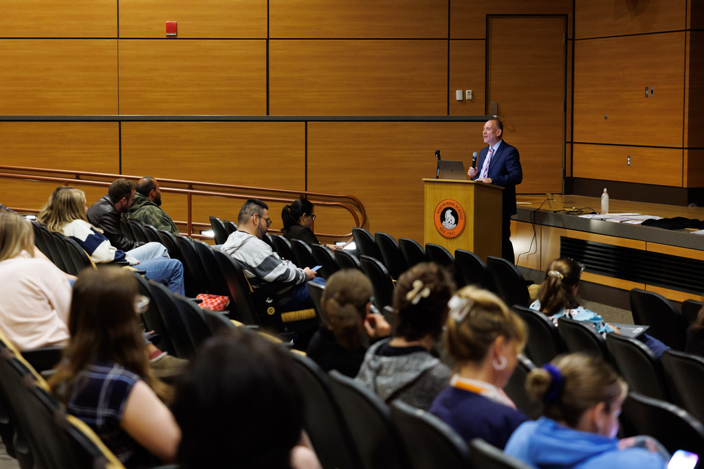 Superintendent Brian E. Allen speaks to a room of educators.
