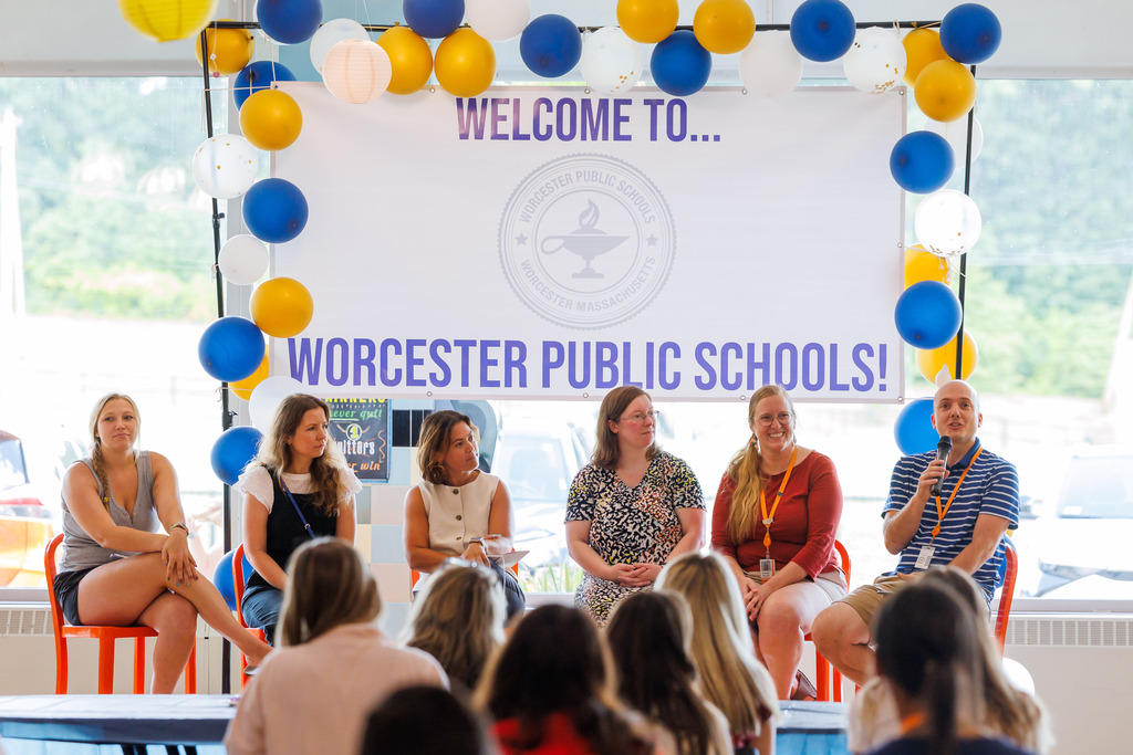 A group of experienced educators lead a panel discussion.