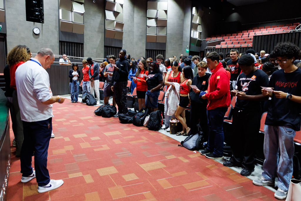 Student-athletes at South High stand together to take the pledge against racism.