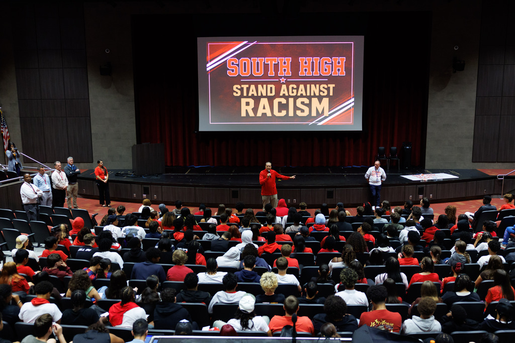 Student-athletes at South High sit in the auditorium for an assembly.
