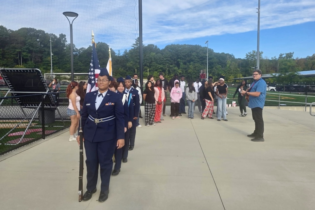 Students in JROTC stand in formation together.