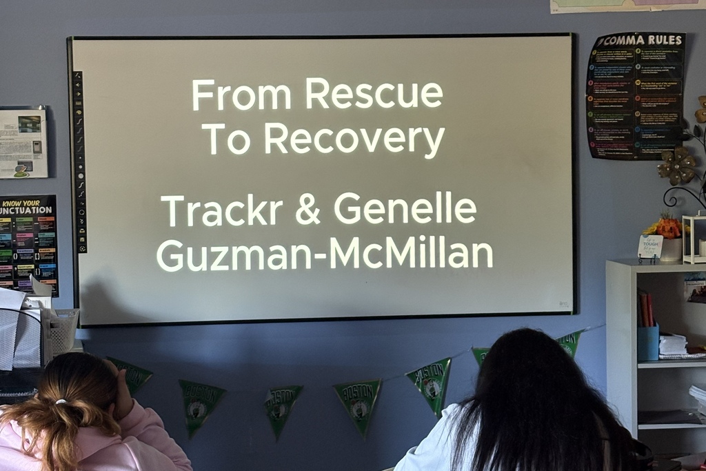 Students watch a video titled "From Rescue to Recovery"