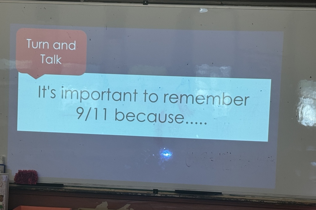A screen reads "Turn and Talk: It's Important to remember 9/11 because..."