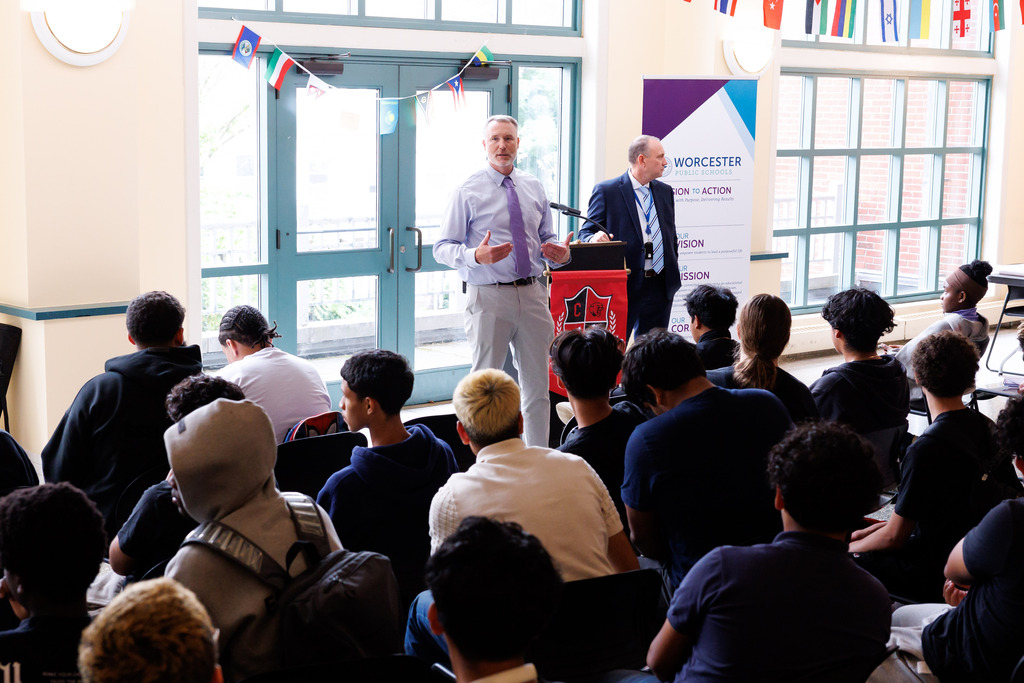 Principal Chris LaBreck speaks with students during a Stand Against Racism assembly.