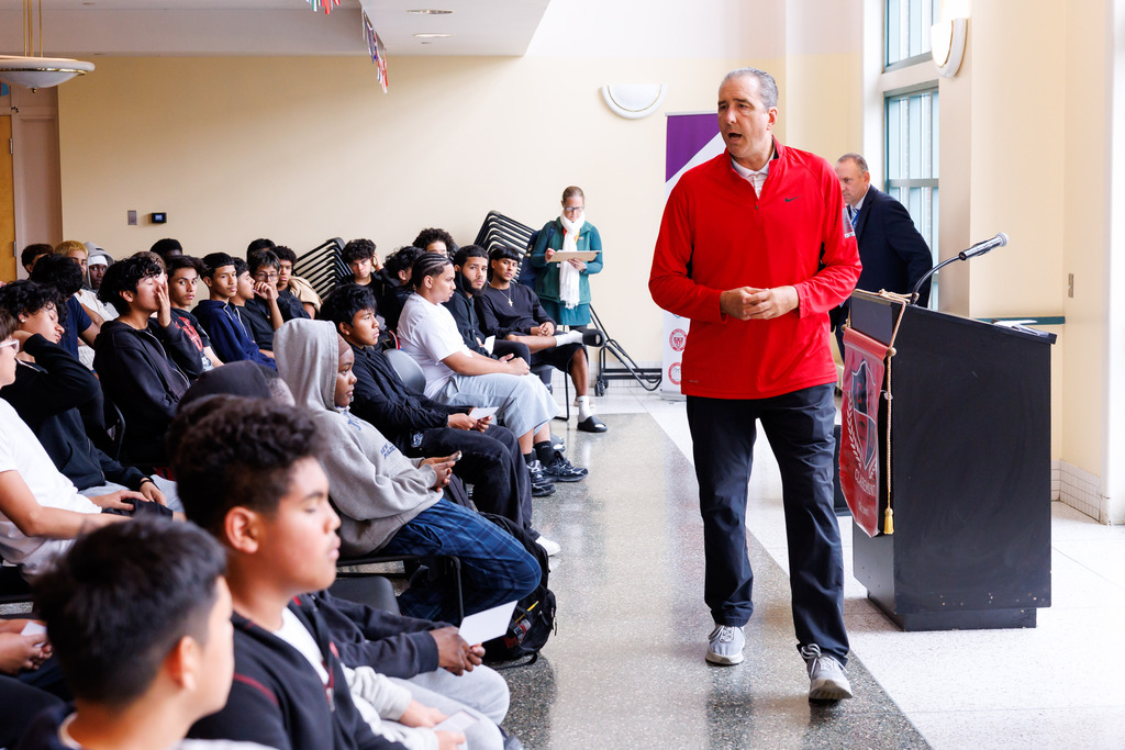 Athletic Director Dave Shea speaks with student-athletes at Claremont Academy and University Park.