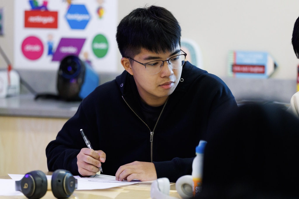 Students work together on a class lesson.