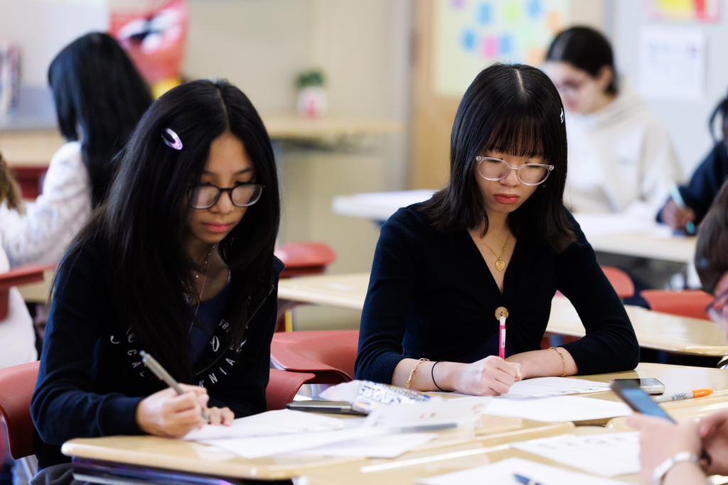 Students work together on a class lesson.