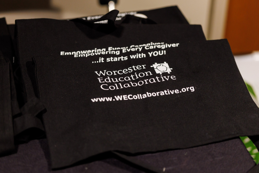 A bag with the Worcester Education Collaborative logo.
