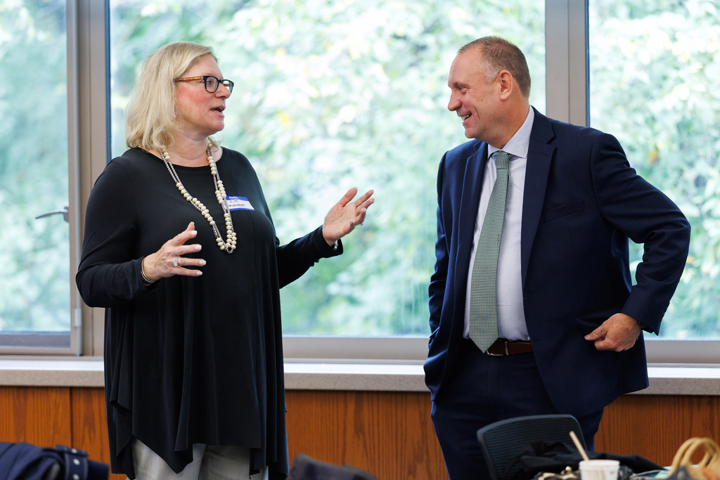 Superintendent Brian E. Allen speaks with a community member.