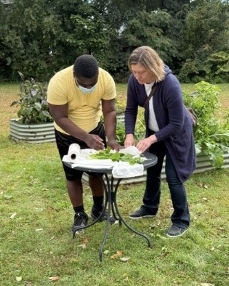 Students and staff in the WPS Transition Program wash and dry freshly picked vegtables.