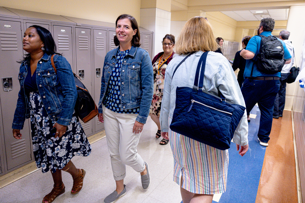 A teacher walks through the hallways.