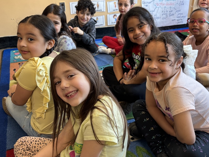 Kindergarten students on a classroom mat