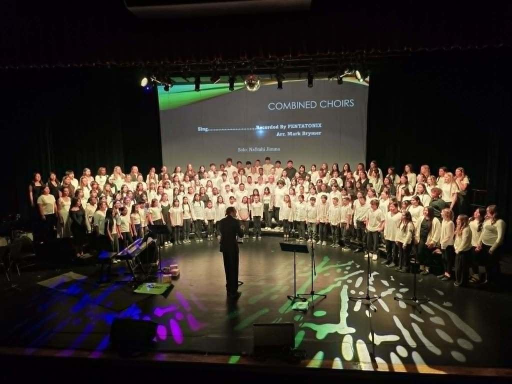 Combined WMS Choirs on risers at Memorial Auditorium