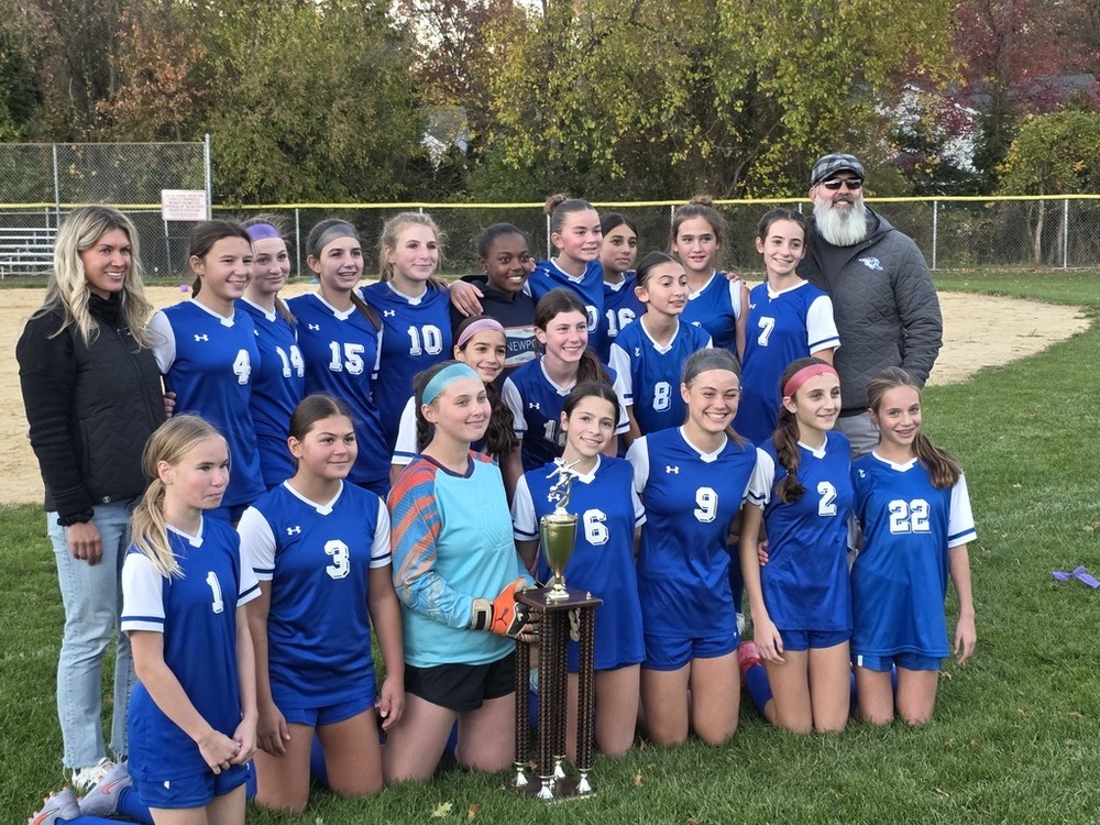 girls soccer team with trophy