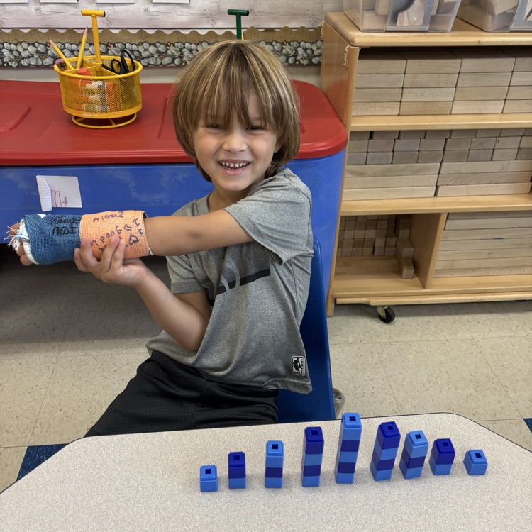 boy building with color box