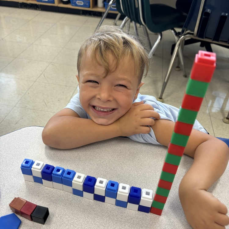 boy building with color blocks