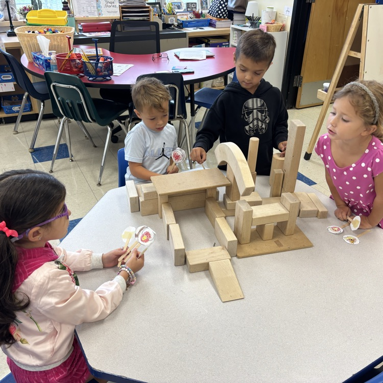 students playing with box